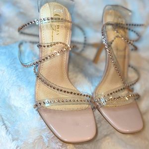 Beautiful stud embellished strappy heels. Never worn.